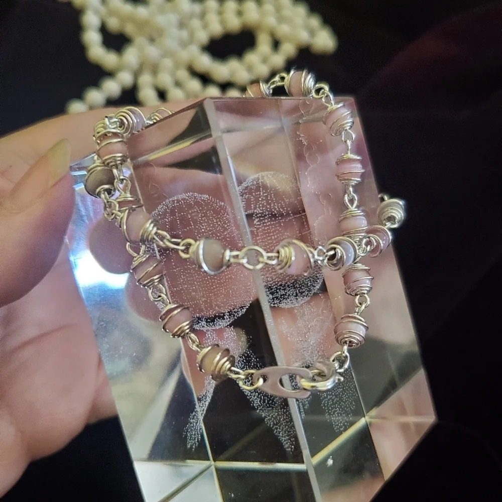 Two silver with pink pearl stones